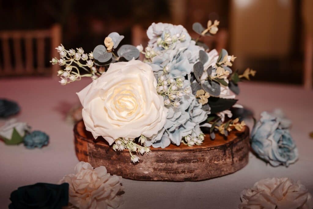 Gorgeous white and blue florals on the guests tables in the Tudor Barn