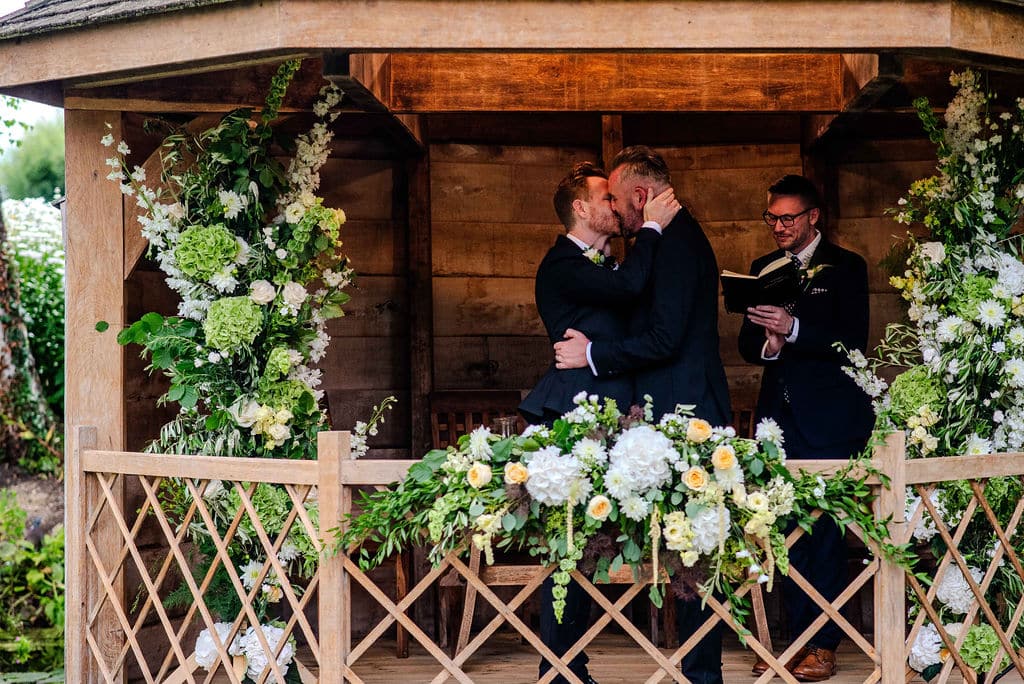 Groom & Groom share a special kiss in the Summerhouse during humanist ceremony 