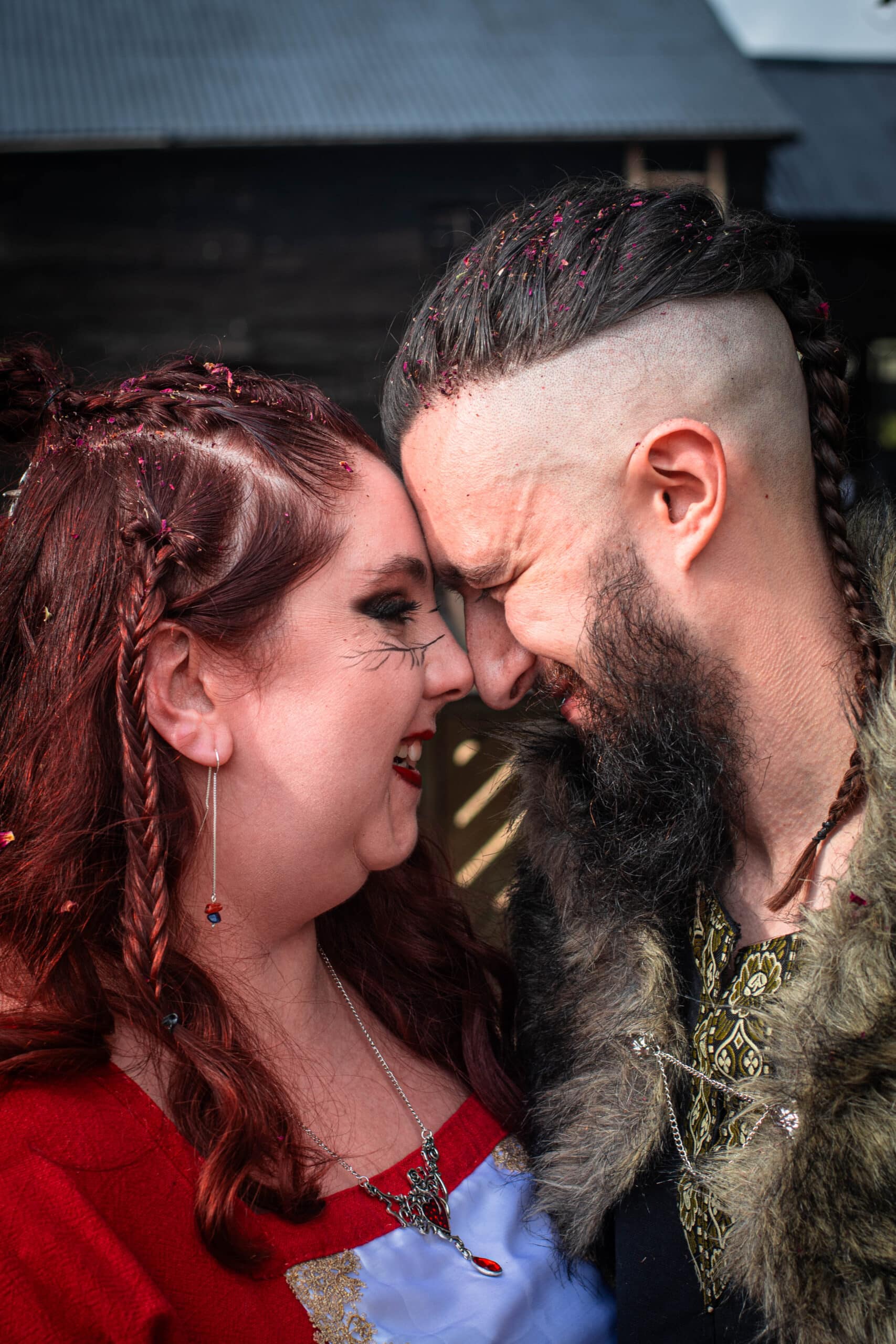 Bride and groom sharing a special moment together after the confetti photo, covered in conffetti at eco conscious wedding venue in Cambridgeshire