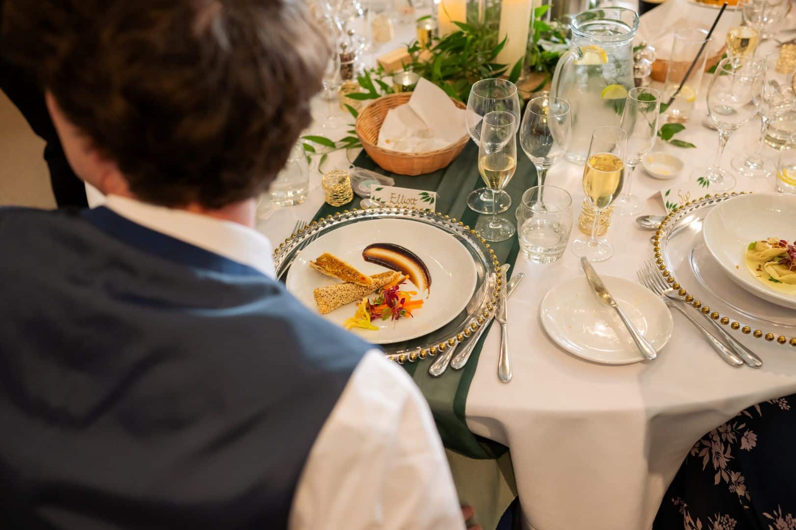 Wedding guest about to tuck into mouthwatering duck spring roll home-made from barn wedding venue