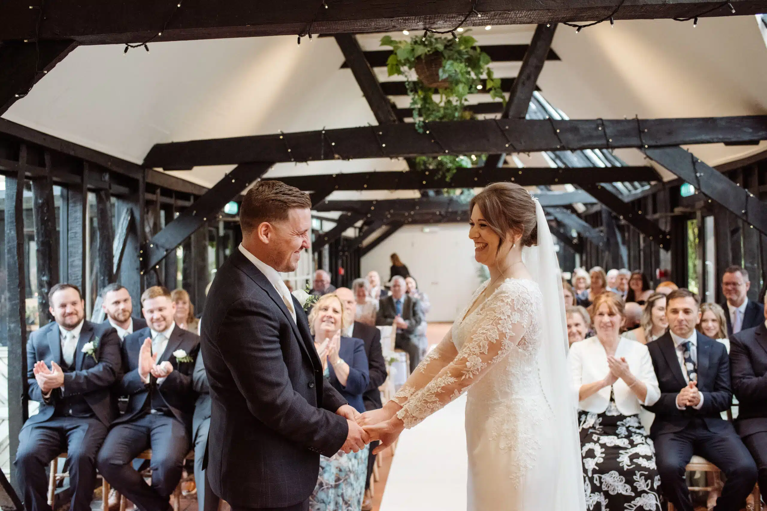 Bride and Groom standing in the Old Dairy saying their vowels during their intimate ceremony