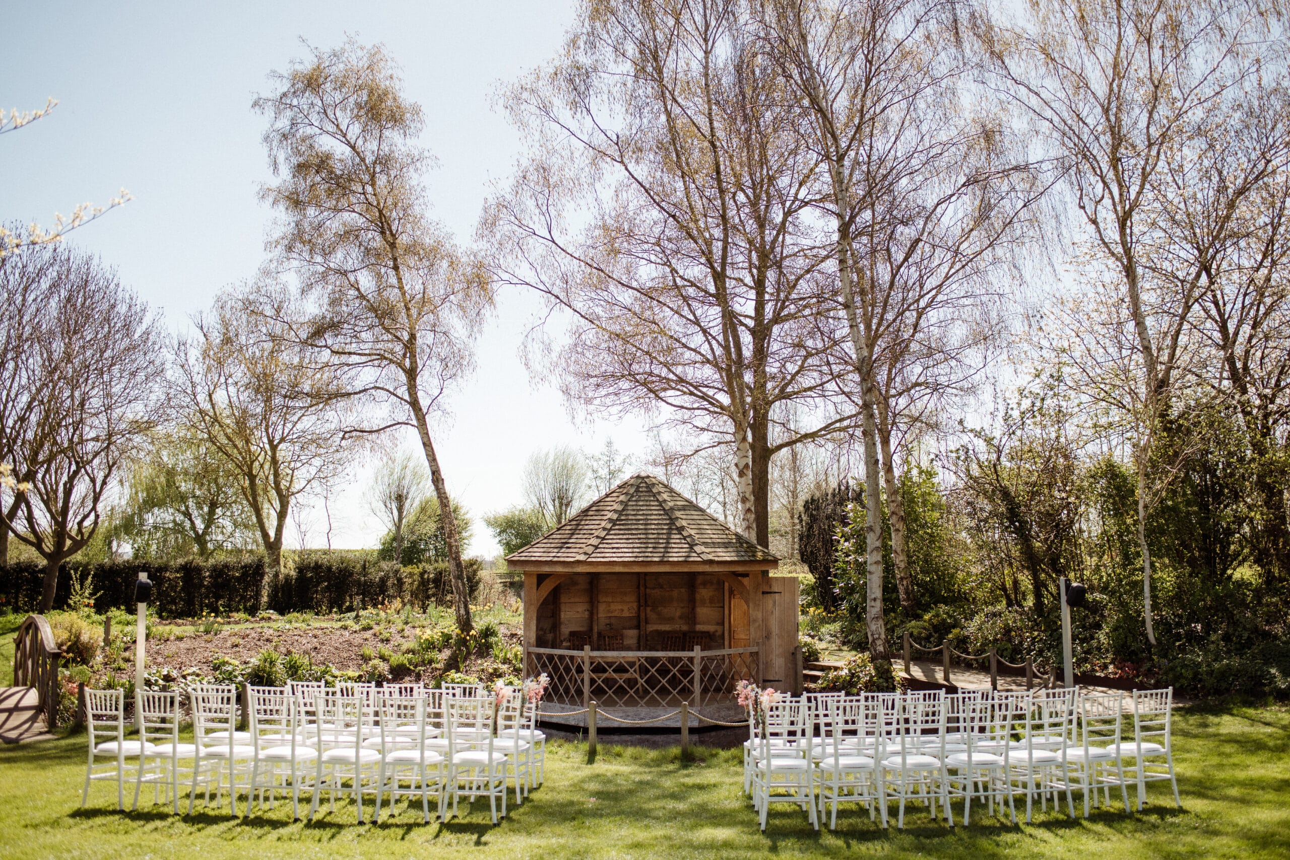 The Summerhouse at South Farm with a Spring backdrop at outdoor garden wedding venue in Cambridgshire