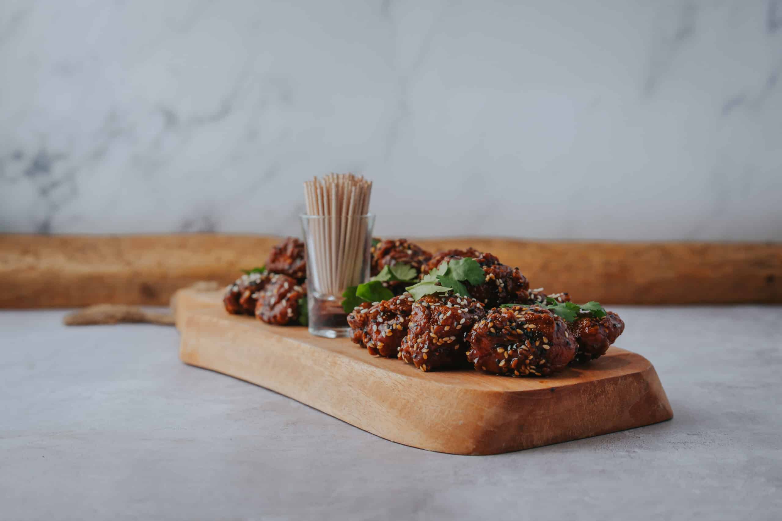 South Farm wedding venue gochujang fried chicken displayed on board for canapes