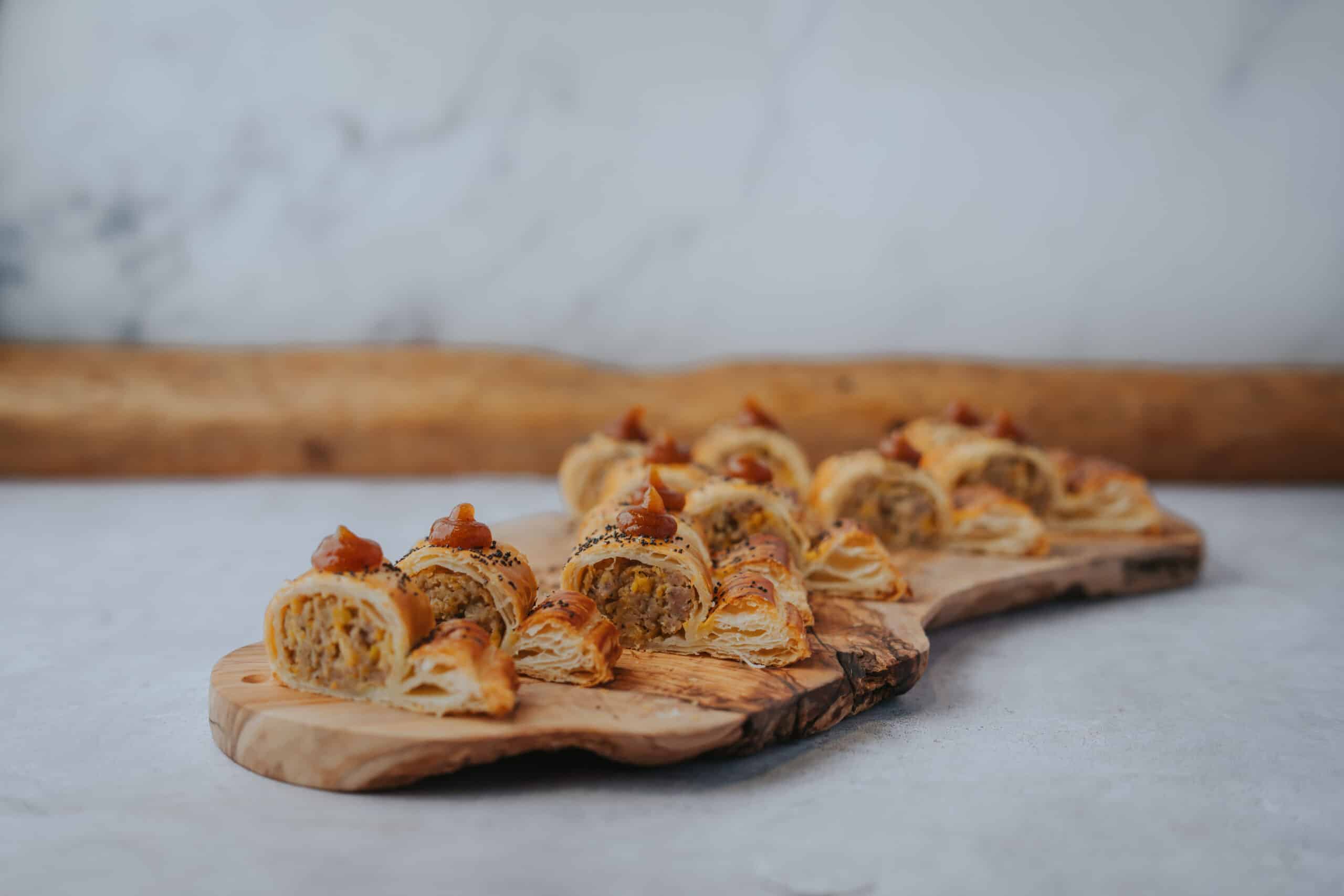 Wedding venue South Farm Sausage Roll, Apricot, Sage, Apple Ketchup displayed on board