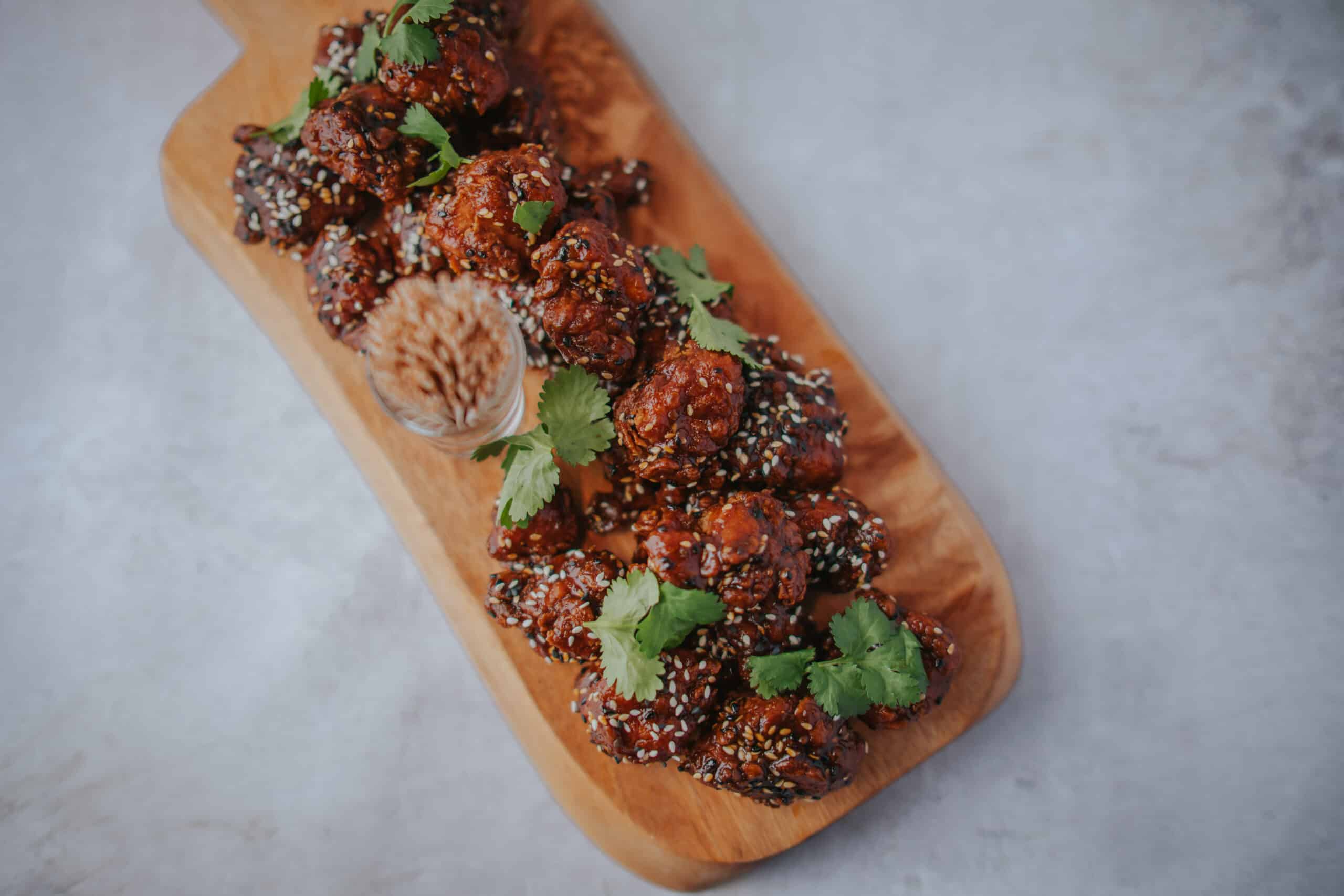 South Farm wedding venue gochujang fried chicken displayed on board for canapes