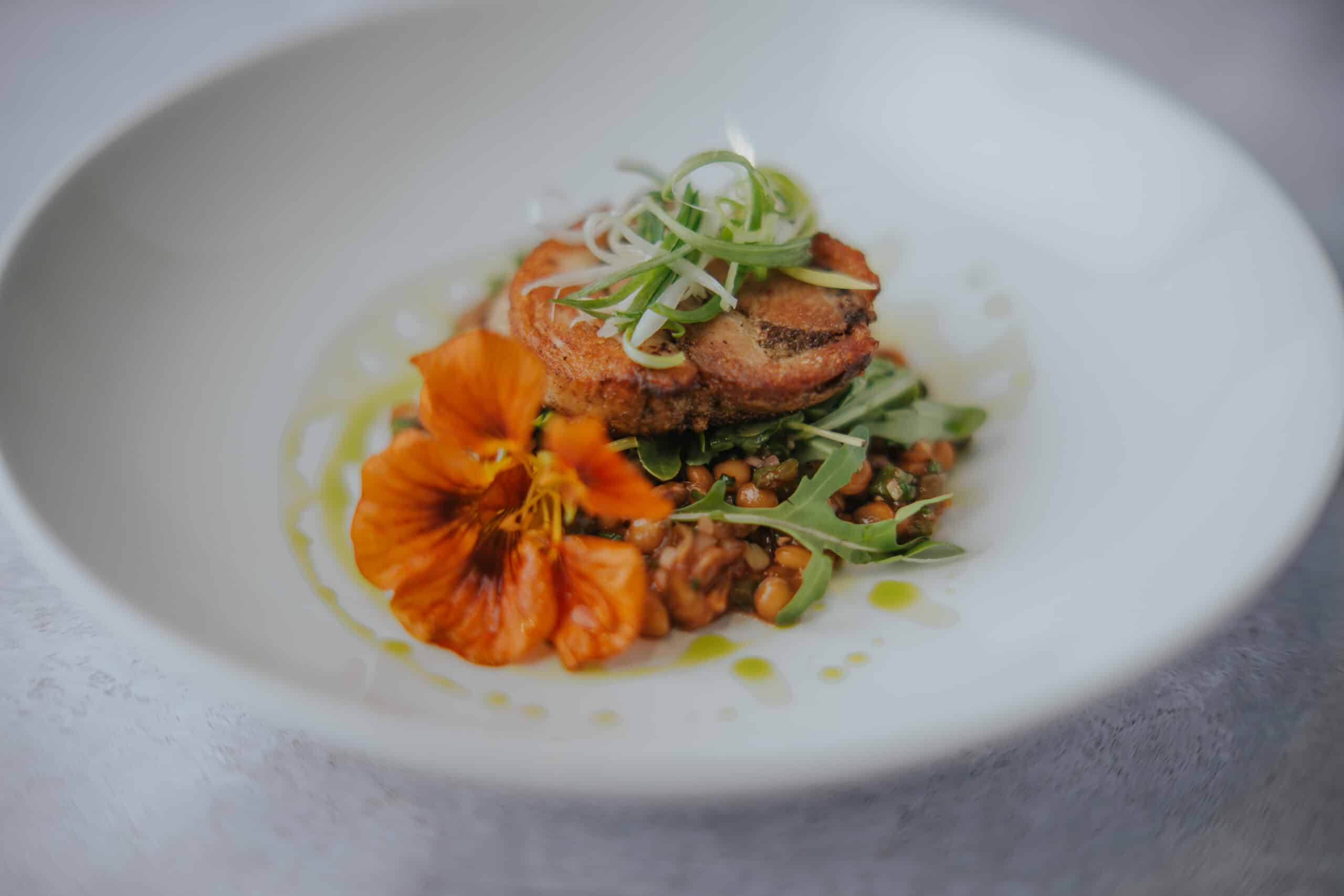 Wedding venue starter Slow cooked South Farm Pork Belly, Caper, Sage, Lentil & Bean Salad