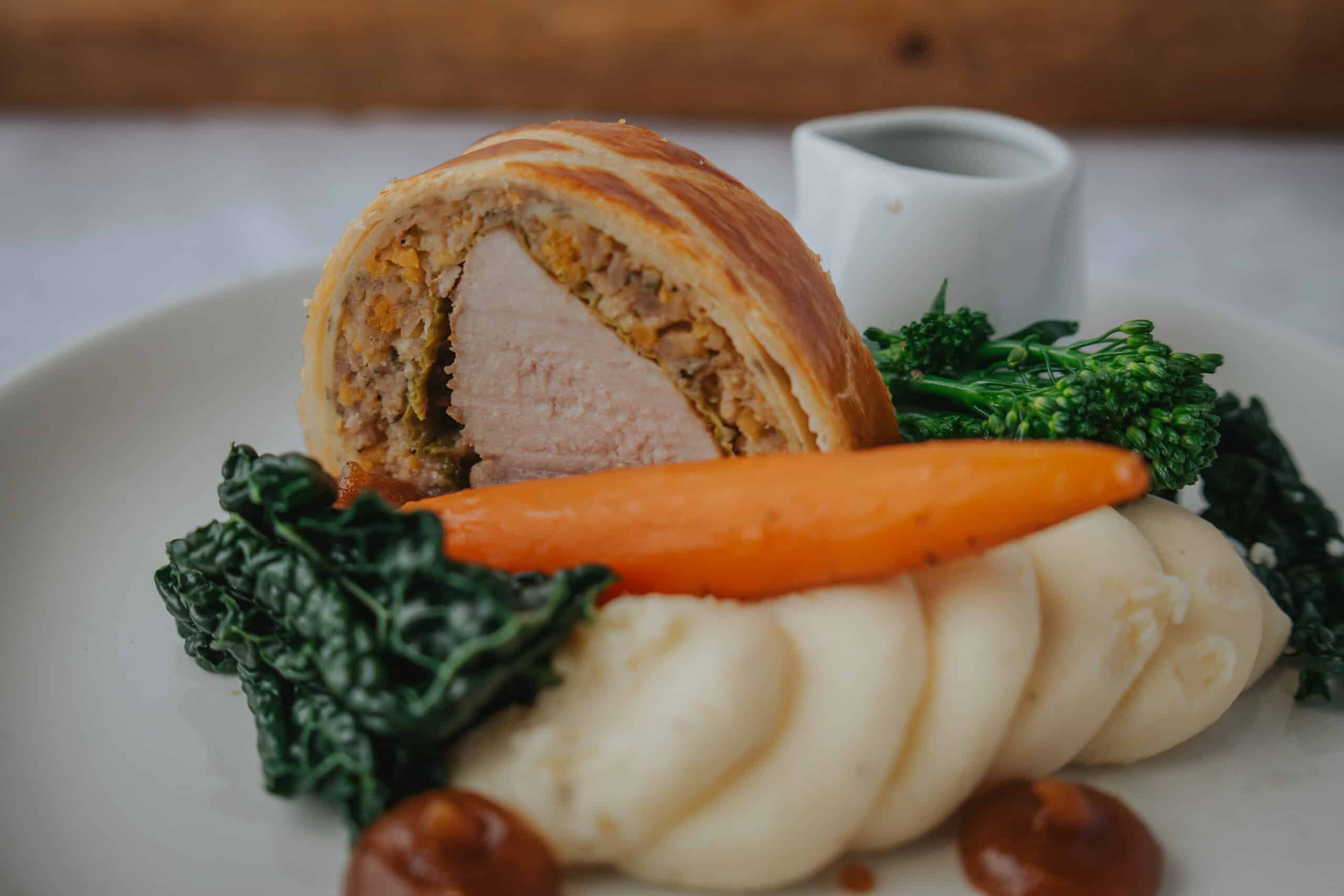 South Farm Pork Wellington, Sage & Apricot Stuffing, Cabbage, Pork & Cider Jus
