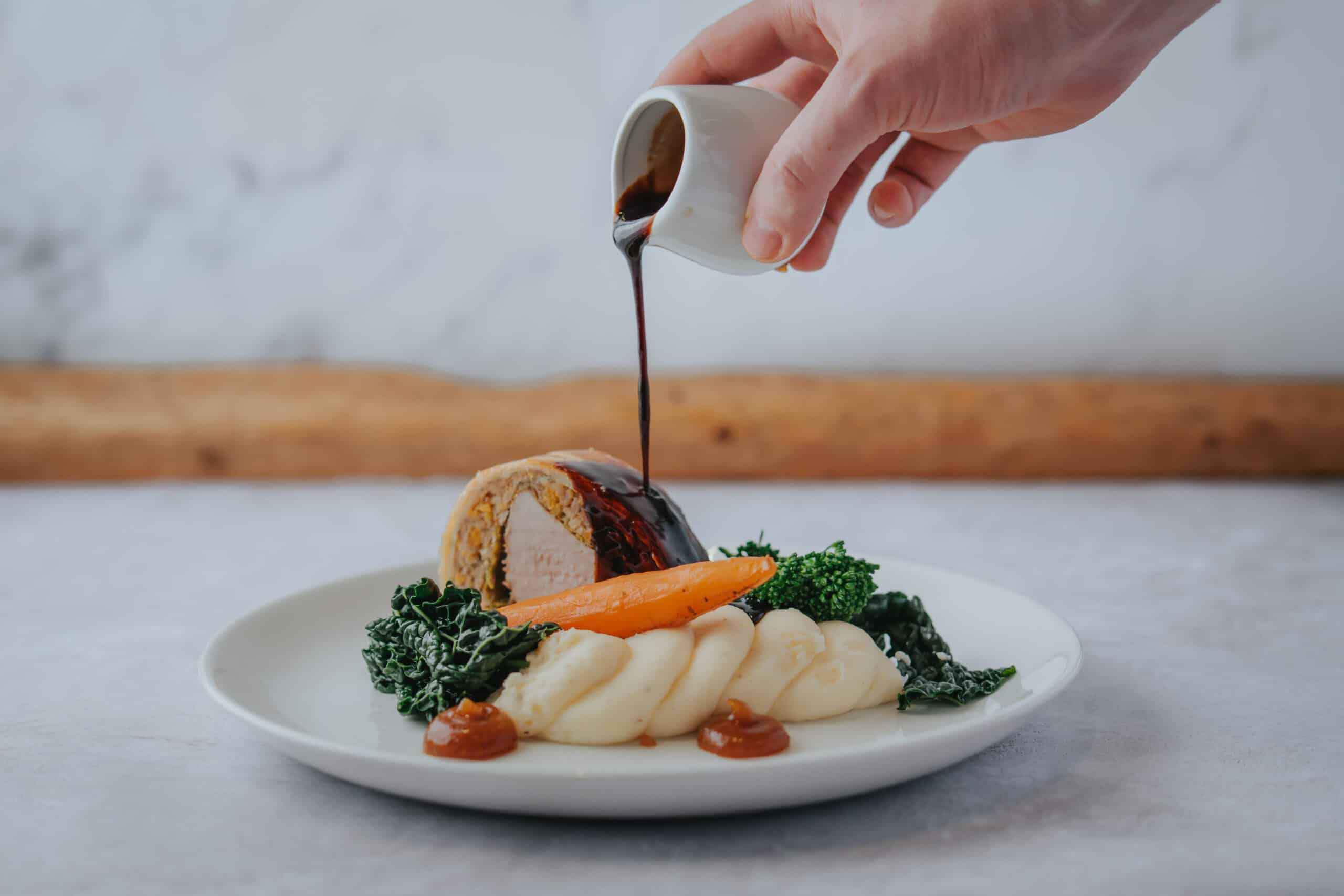 South Farm Pork Wellington, Sage & Apricot Stuffing, Cabbage, Pork & Cider Jus