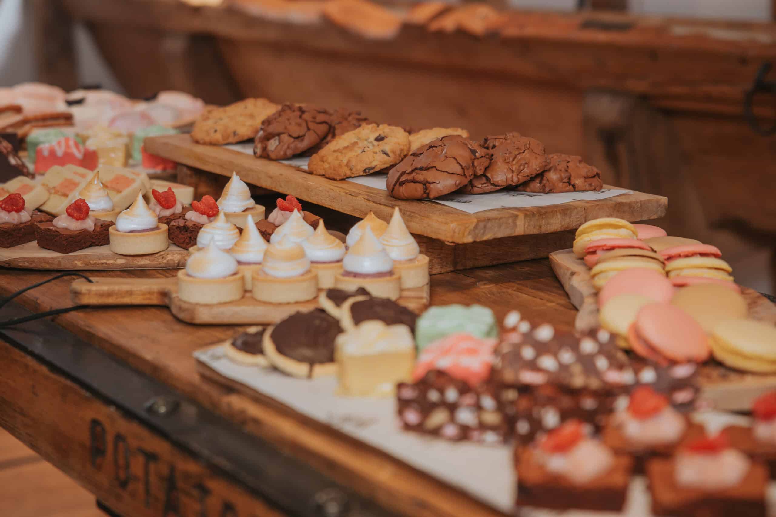 Wedding venue sweet treat cart display on vintage cart