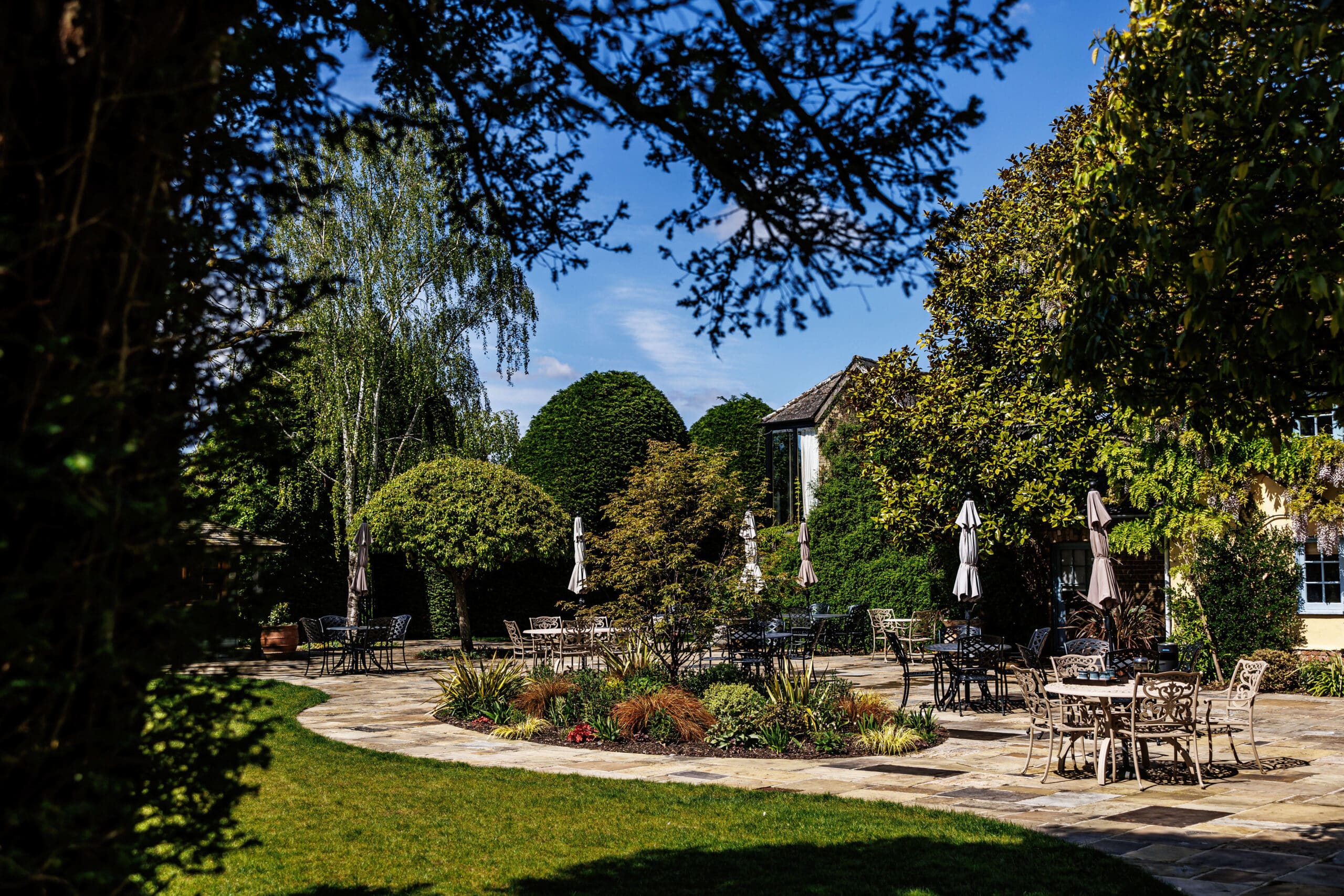 Garden with patio and sweeping terrace on a May wedding day