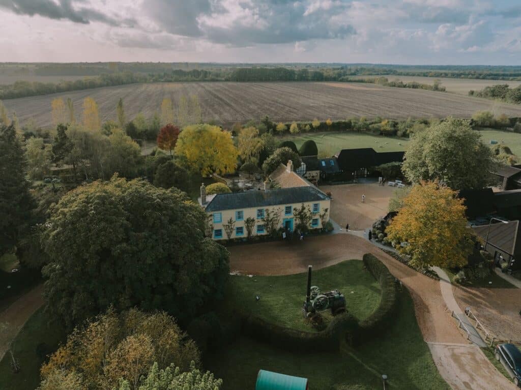 Aerial image of sustainable farm wedding venue on a November day with changing colour leaves