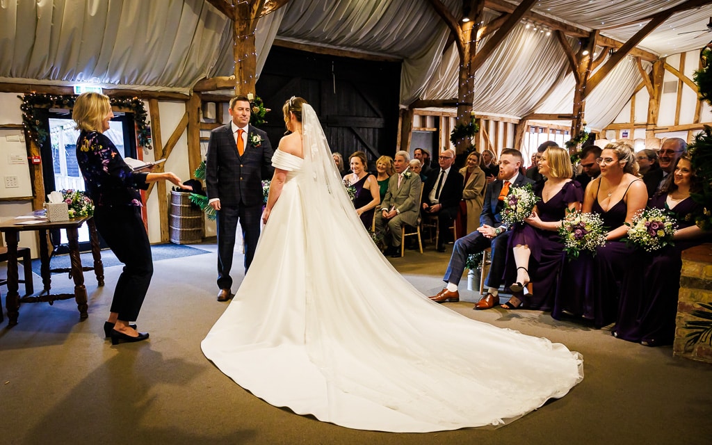 Bride and Groom in the Tudor Barn having during their intimate ceremony at wedding venue in Hertfordshire