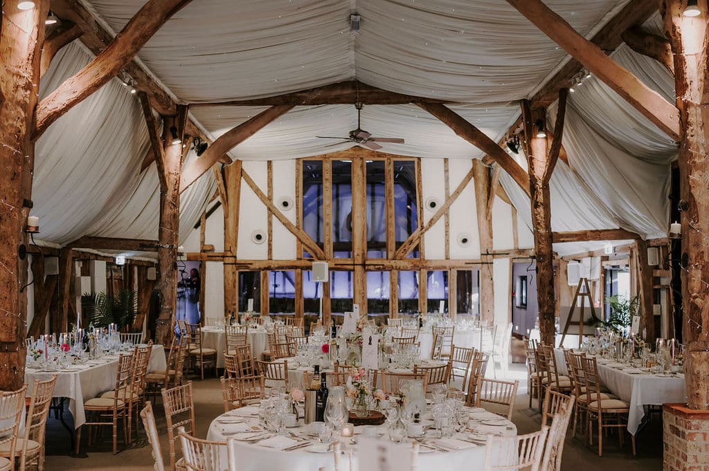 Elegant Tudor Barn wedding reception setup.
