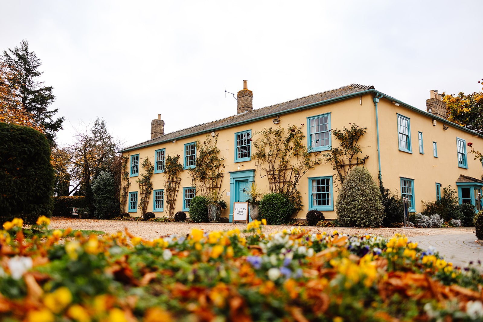 Charming yellow building with flowers