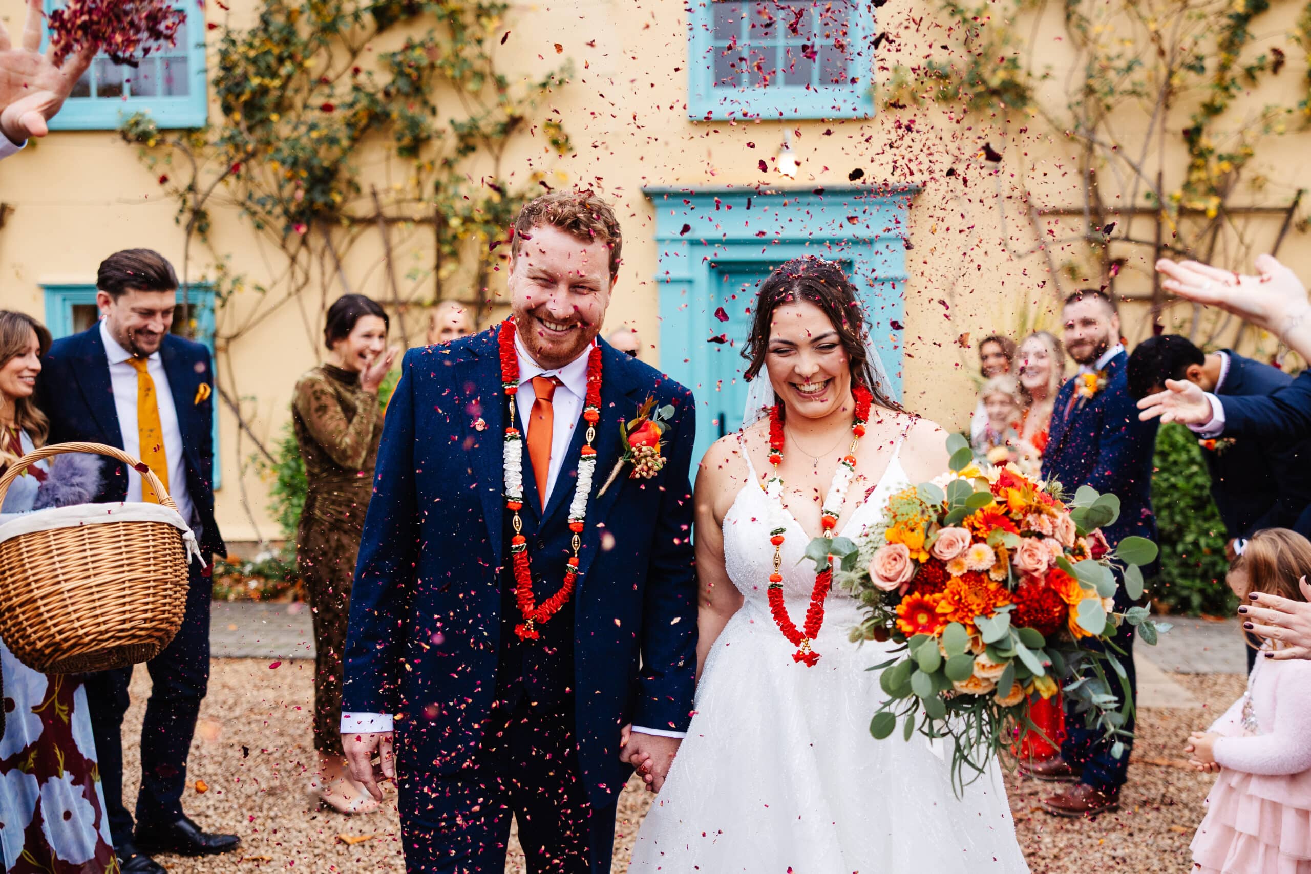 Couple celebrating with flower confetti