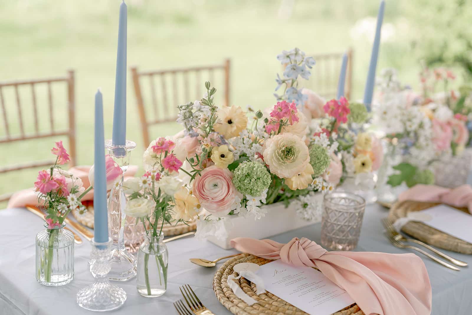 Elegant floral table setting outdoors.