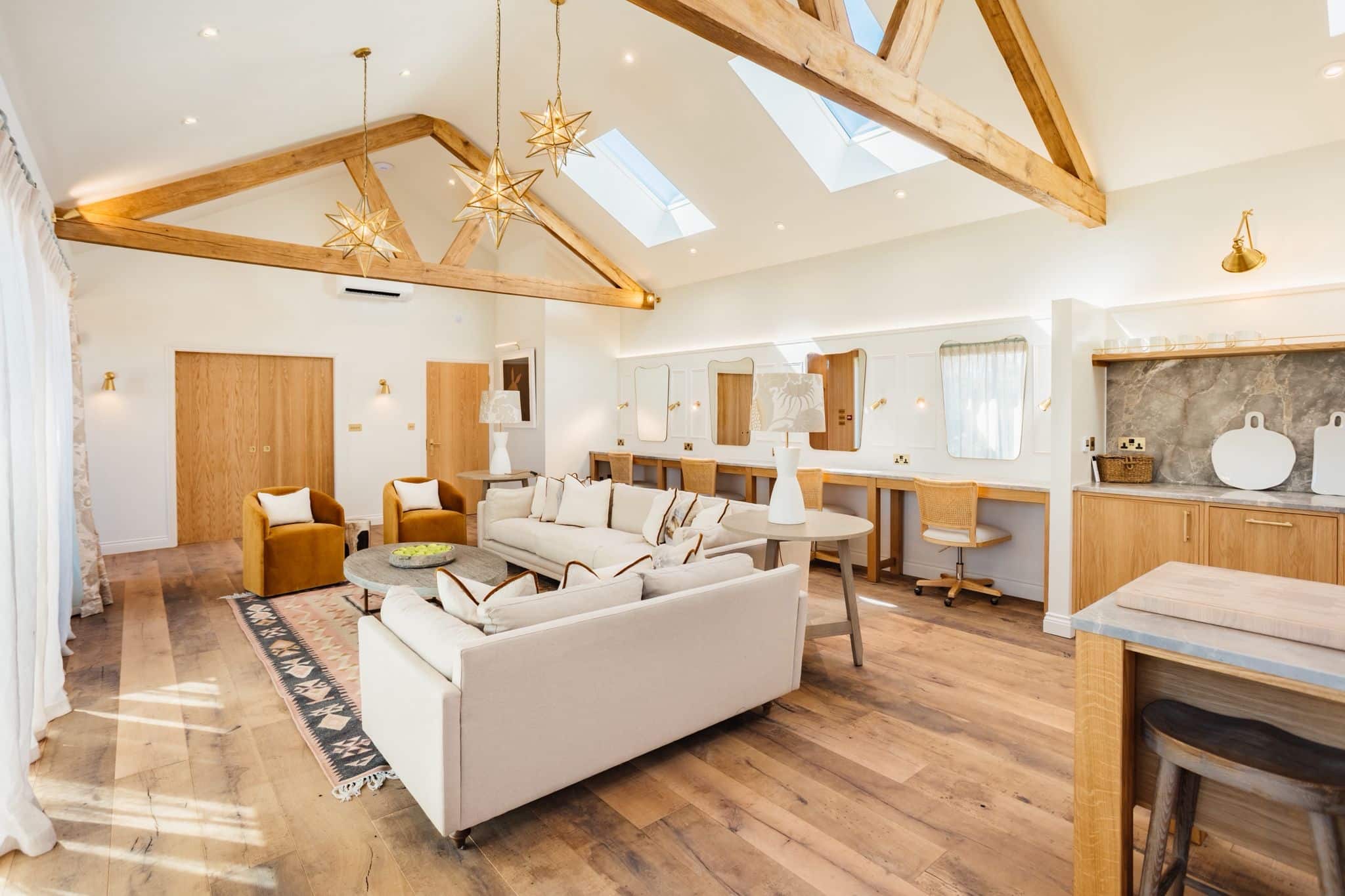 Spacious, modern living room with skylights