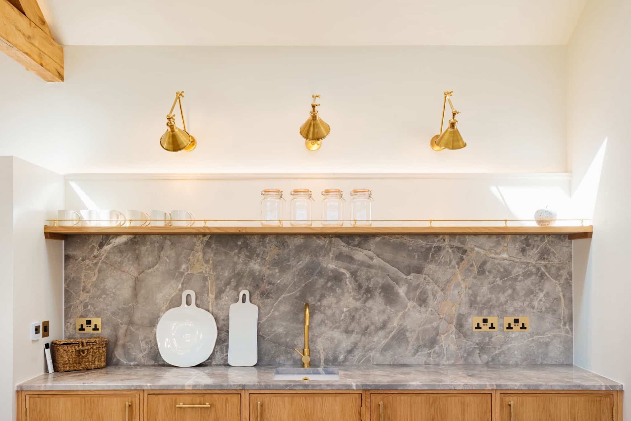 Stylish fully furnished kitchen space with marble worktops for prep area
