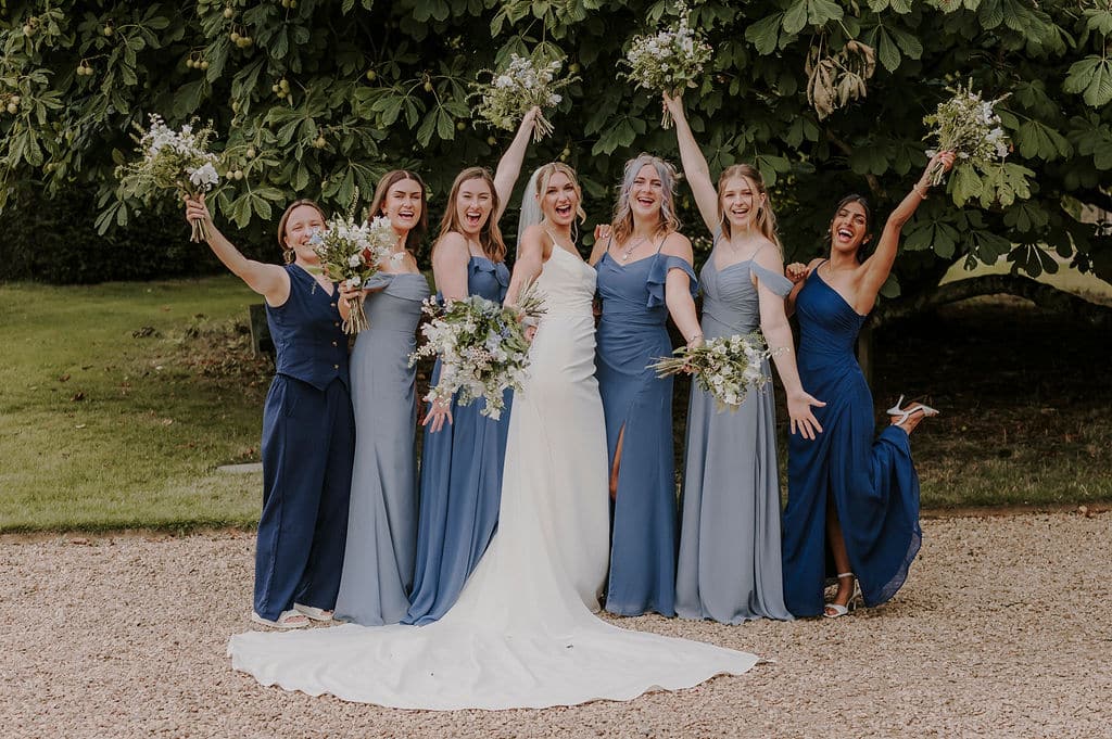 Bride and bridesmaids in stunning wedding gardens