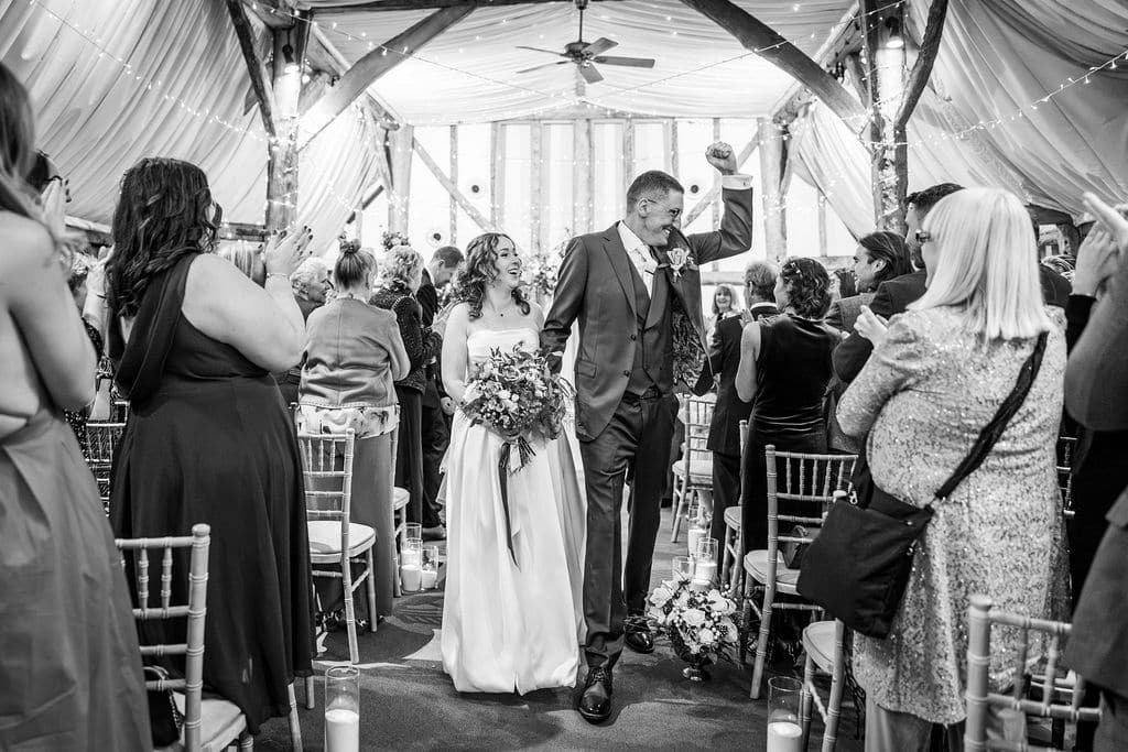 Bride and groom celebrating wedding exit.