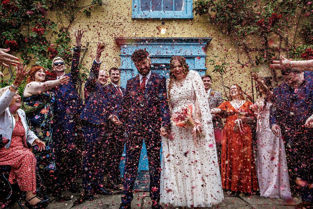 Couple celebrating with confetti shower.