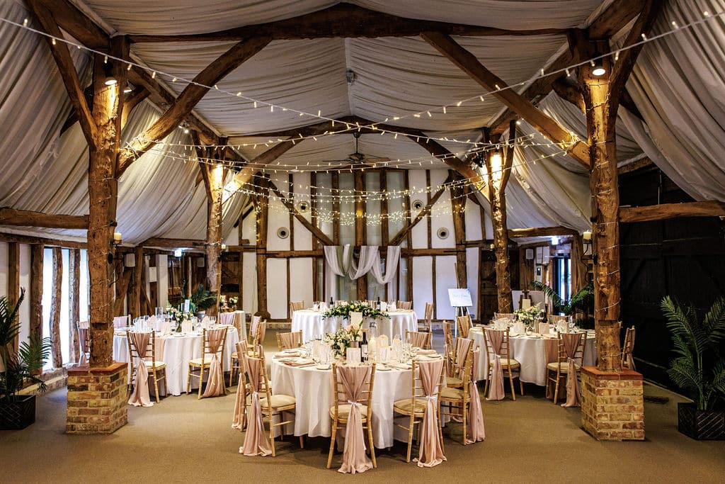 Small intimate wedding breakfast in the Tudor Barn at South Farm wedding venue