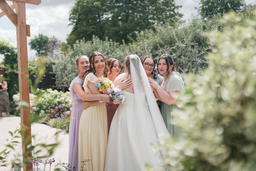 Bride and Bridesmaids on wedding day in stunning gardens